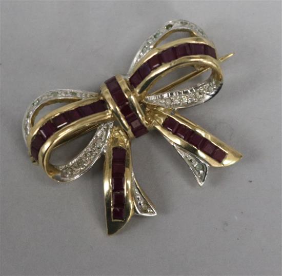 A 9ct gold ruby and diamond ribbon bow brooch, 26mm.